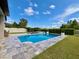 Resort-style pool and spa area with lush landscaping for ultimate relaxation at 19636 Long Lake Ranch Blvd, Lutz, FL 33558