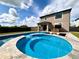 Beautiful pool with hot tub and patio furniture against a backdrop of blue skies at 19636 Long Lake Ranch Blvd, Lutz, FL 33558