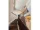 Modern staircase with wood railings and hardwood steps ascending to the upper level at 19636 Long Lake Ranch Blvd, Lutz, FL 33558