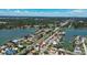 Gorgeous view of a waterfront community showcasing lovely homes near the open water, surrounded by lush trees at 2 79Th S St, St Petersburg, FL 33707