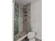 Modern bathroom featuring tiled shower with glass tile accent wall and updated fixtures at 2 79Th S St, St Petersburg, FL 33707