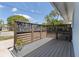 Cozy front porch featuring a modern privacy screen and composite deck at 2 79Th S St, St Petersburg, FL 33707