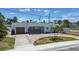 Charming single-story home with a circular driveway and a garage on the side at 2 79Th S St, St Petersburg, FL 33707