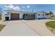 Charming single-story home with a private front yard and attached garage at 2 79Th S St, St Petersburg, FL 33707