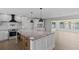 Modern kitchen featuring a large granite island, stainless appliances, and ample cabinet space at 2 79Th S St, St Petersburg, FL 33707
