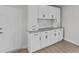 Kitchen pantry with white cabinets and granite countertops at 2 79Th S St, St Petersburg, FL 33707