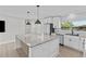 Spacious kitchen featuring granite countertops, stainless appliances, and bright lighting at 2 79Th S St, St Petersburg, FL 33707