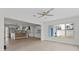 Open floor plan showcases the living room, kitchen, and a bright window at 2 79Th S St, St Petersburg, FL 33707