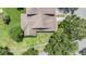 Aerial view of a lovely landscaped home with a well-maintained roof at 20302 Noble Oak Pl, Tampa, FL 33647