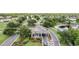 A picturesque view of the neighborhood's charming guard house entrance with meticulously manicured landscaping at 20302 Noble Oak Pl, Tampa, FL 33647