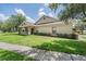 Charming exterior view of home and well-manicured lawn at 20302 Noble Oak Pl, Tampa, FL 33647