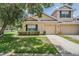 Charming townhome with a well-manicured lawn and inviting curb appeal at 20302 Noble Oak Pl, Tampa, FL 33647