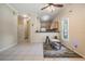 Open-concept space with kitchen view, perfect for entertaining, and featuring tile flooring at 20302 Noble Oak Pl, Tampa, FL 33647