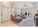 Bright living room features a comfortable gray sectional and lots of natural light at 20302 Noble Oak Pl, Tampa, FL 33647