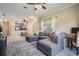 Cozy living room flowing into kitchen; features a large sectional and ample space at 20302 Noble Oak Pl, Tampa, FL 33647