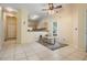 Open-concept space with kitchen view, perfect for entertaining, featuring tile flooring at 20302 Noble Oak Pl, Tampa, FL 33647