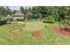 Putting green surrounded by lush landscaping, offering a serene space for golf practice at 20302 Noble Oak Pl, Tampa, FL 33647