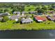 Picturesque aerial view of a waterfront community with manicured lawns and mature trees at 2110 W View Dr, Sun City Center, FL 33573
