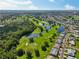 A gorgeous aerial perspective of a lush golf course community adorned with serene lakes and homes at 2110 W View Dr, Sun City Center, FL 33573