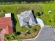 An aerial view showcases this home with a well-maintained lawn near a beautiful canal at 2110 W View Dr, Sun City Center, FL 33573