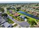 Aerial view of a peaceful residential neighborhood with houses alongside a scenic canal at 2110 W View Dr, Sun City Center, FL 33573