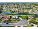 Aerial view of a residential neighborhood with waterfront homes and lush greenery at 2110 W View Dr, Sun City Center, FL 33573