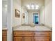 Bathroom vanity featuring granite countertop, wood cabinets, and modern lighting fixture at 2110 W View Dr, Sun City Center, FL 33573