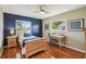 Cozy bedroom featuring hardwood floors and natural light at 2110 W View Dr, Sun City Center, FL 33573