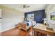 Bright bedroom featuring wood floors, a ceiling fan and a desk by the window at 2110 W View Dr, Sun City Center, FL 33573