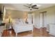 A bright bedroom showcases hardwood floors, a ceiling fan, and neutral decor at 2110 W View Dr, Sun City Center, FL 33573