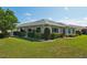 Charming single-story home featuring manicured landscaping and a well-maintained lawn at 2110 W View Dr, Sun City Center, FL 33573
