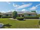 Charming single-story home with a well-manicured lawn and neatly trimmed hedges at 2110 W View Dr, Sun City Center, FL 33573