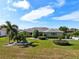 Well-maintained single-story home showcasing lush landscaping and curb appeal at 2110 W View Dr, Sun City Center, FL 33573