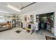 Bright garage with utility sink, shelving, and storage for tools and equipment at 2110 W View Dr, Sun City Center, FL 33573