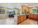 Eat in Kitchen with granite countertops next to a large window with nice backyard views at 2110 W View Dr, Sun City Center, FL 33573