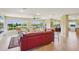 Bright living room with a stunning water view from the multiple windows at 2110 W View Dr, Sun City Center, FL 33573