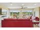 A spacious living room features a large rug, stylish sofas, and expansive views of the waterfront at 2110 W View Dr, Sun City Center, FL 33573