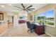 Open floorplan with living spaces, a home office, and tile floors throughout at 2110 W View Dr, Sun City Center, FL 33573