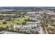 High-angle shot showcasing a multi-story condo building with views of the adjacent golf course and surrounding neighborhood at 225 Country Club Dr # 1506, Largo, FL 33771