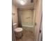 Compact bathroom features a shower-tub combo, toilet, and linen closet at 225 Country Club Dr # 1506, Largo, FL 33771