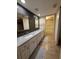 Bathroom with double sink vanity, ample lighting, and modern updates throughout at 225 Country Club Dr # 1506, Largo, FL 33771