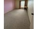 Bedroom with carpet floors and large window bringing in natural light at 225 Country Club Dr # 1506, Largo, FL 33771
