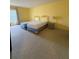 Bright bedroom features carpet flooring, with twin beds, and a side table at 225 Country Club Dr # 1506, Largo, FL 33771