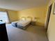 Bedroom with two beds and neutral carpet flooring, ready for personalization at 225 Country Club Dr # 1506, Largo, FL 33771