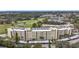Close aerial view of a condo complex featuring multiple units with balconies and exterior staircases at 225 Country Club Dr # 1506, Largo, FL 33771