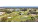 Scenic view of the golf course featuring ponds, sand traps, and well-manicured green at 225 Country Club Dr # 1506, Largo, FL 33771