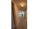 Hallway with carpet and neutral walls leads to bedrooms and living areas at 225 Country Club Dr # 1506, Largo, FL 33771