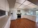 Bright kitchen features sleek appliances, ample countertop space, and wood-look floors at 225 Country Club Dr # 1506, Largo, FL 33771