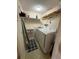 Laundry room features a washer and dryer, shelf, and storage cart at 225 Country Club Dr # 1506, Largo, FL 33771
