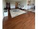 Spacious living room area featuring hardwood floors and a large area rug at 225 Country Club Dr # 1506, Largo, FL 33771